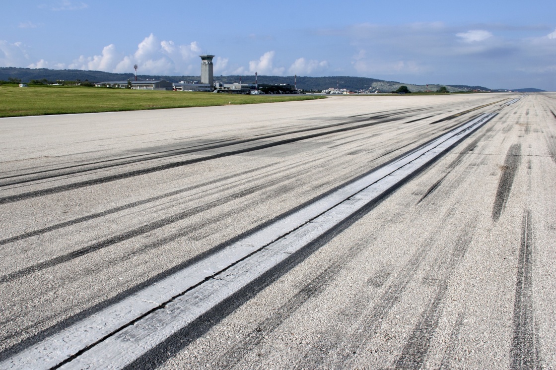 'Concrete runway of Split airport with traces of airplane wheels' - Spalato